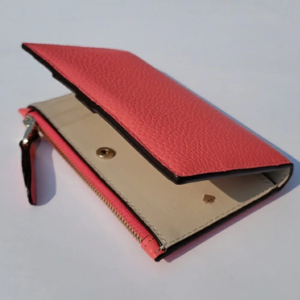 Kate Spade Leather Roulette Small Slim Bifold Wallet. Color: Peachmelba.